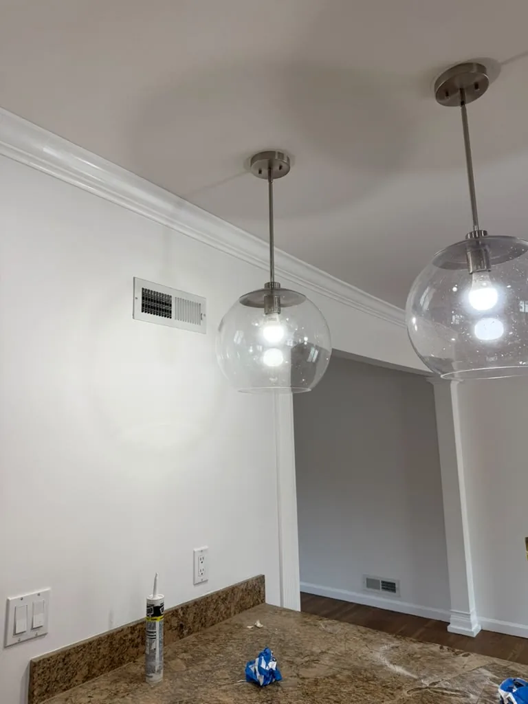 Dining area with glass pendant lighting