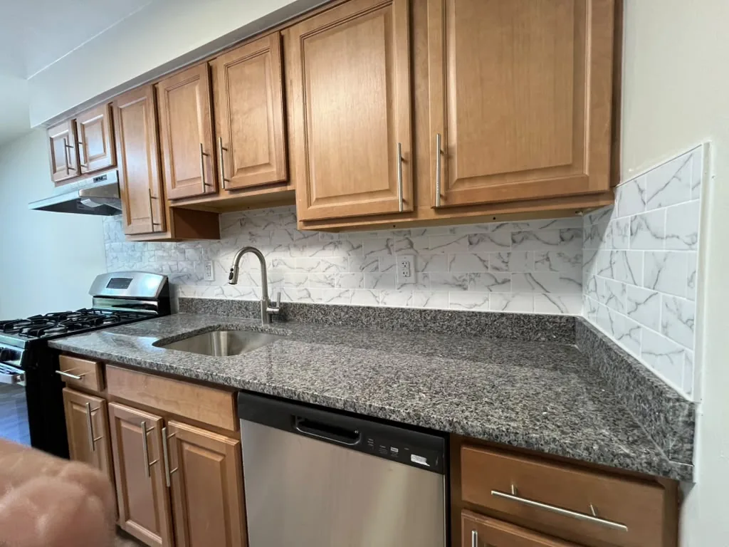 Granite countertop, undermount sink and cabinet detail